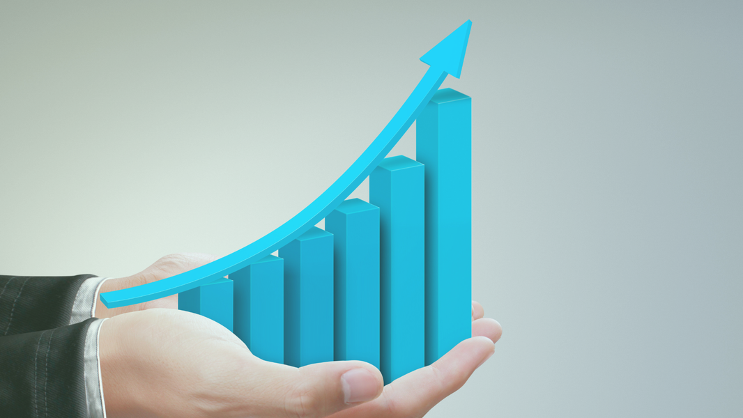 Hand mit aufsteigender Grafik